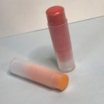 two homemade lip balms using two different pouring methods