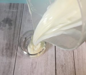 putting diy face cream into container