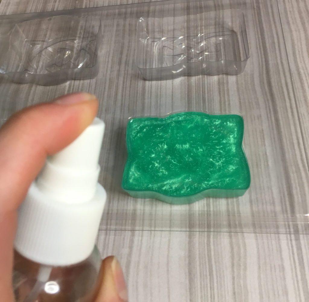 spraying melt and pour soap with alcohol