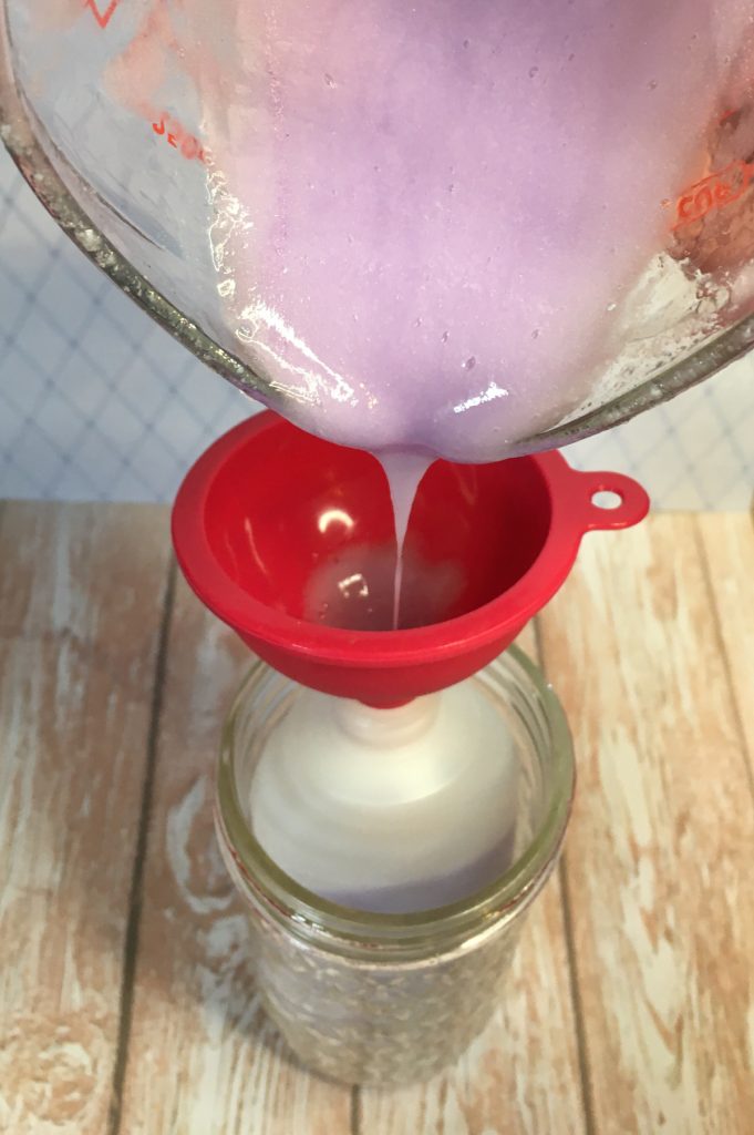 pouring body wash into containers