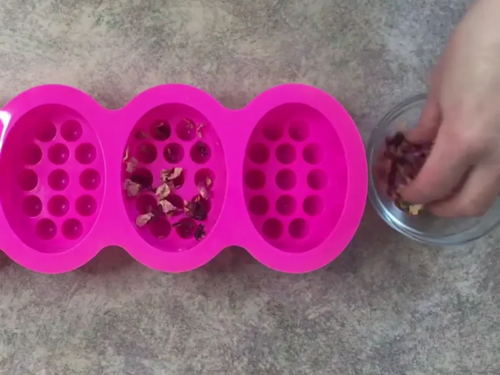 add rose petals to bottom of mold