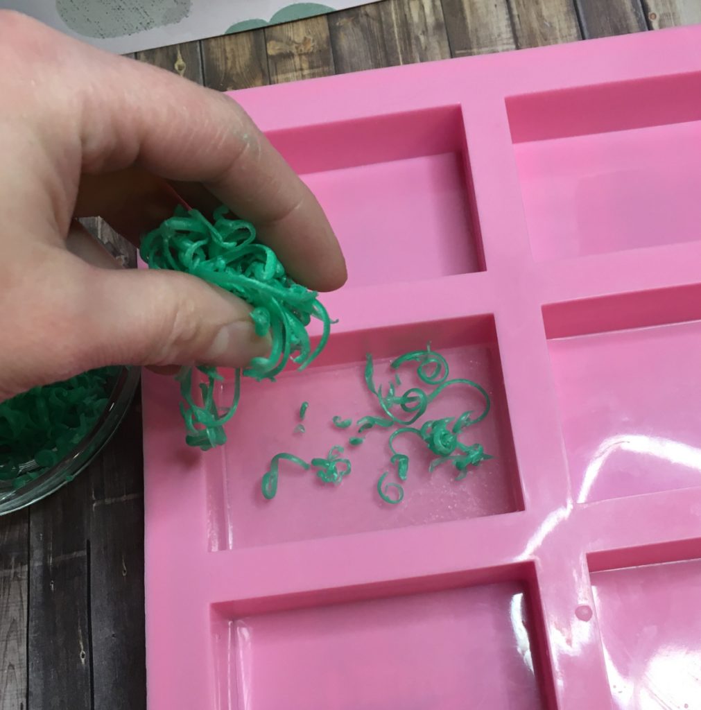 adding green soap grass