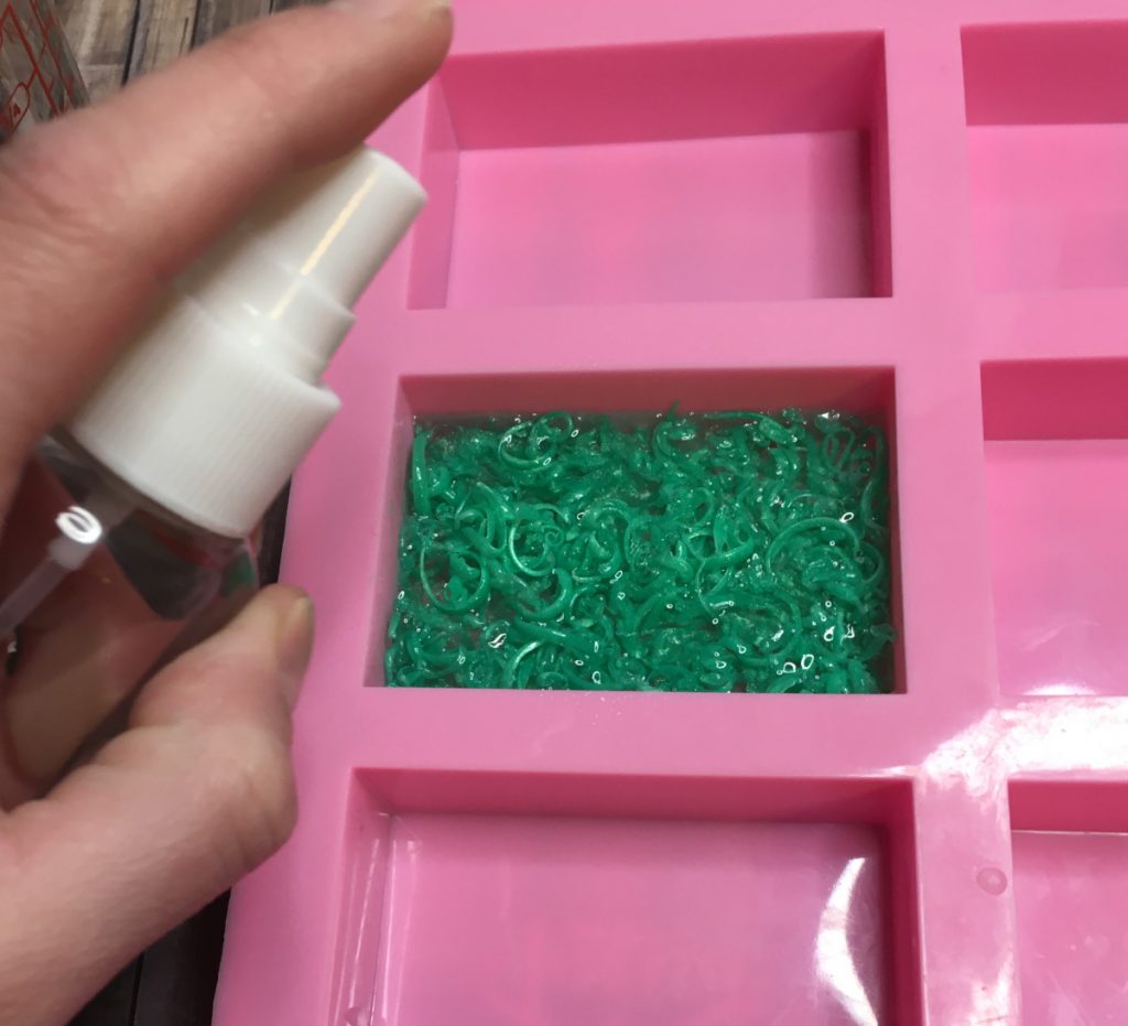 adding melt and pour to soap grass