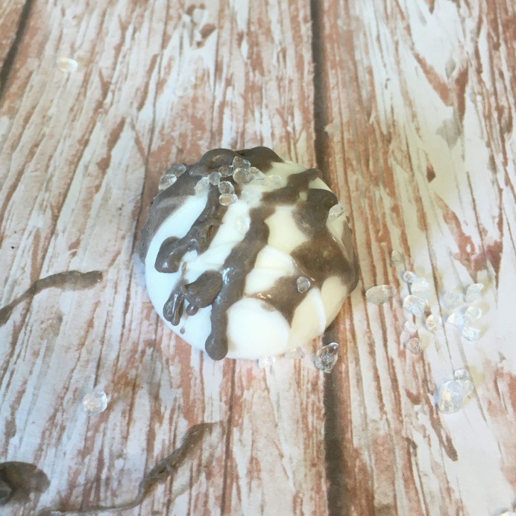 finished white truffle with brown drizzle