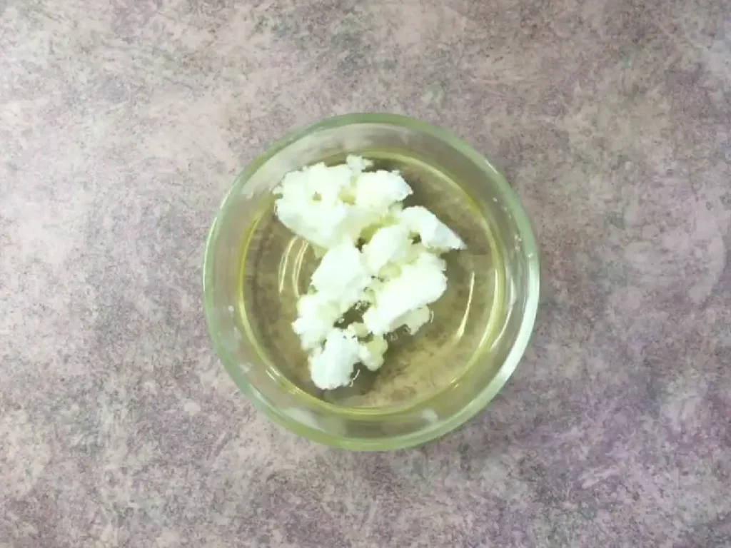 mixing shea butter into heated oils