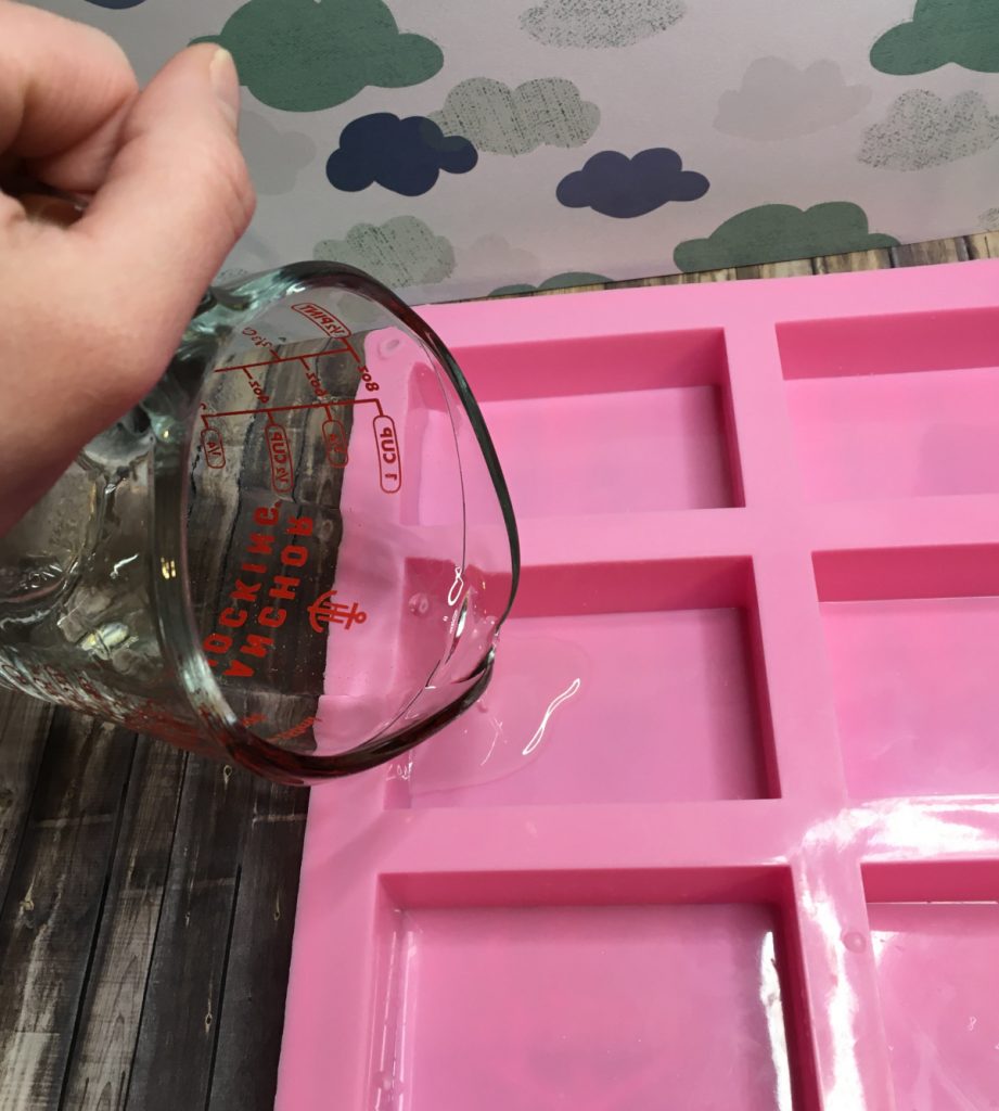 pouring clear melt and pour soap