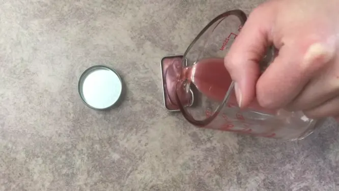 pouring solid perfume into containers
