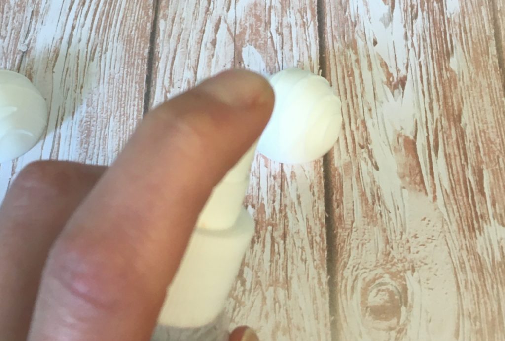 spraying chocolate soap with rubbing alcohol