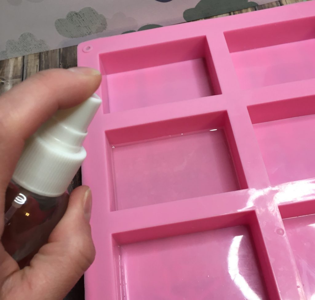 spraying soap with alcohol