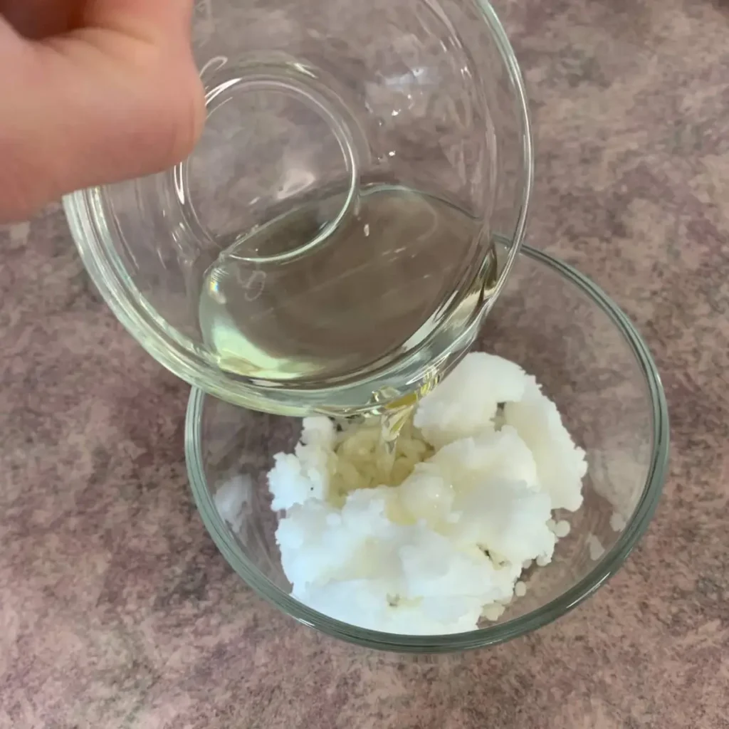 adding coconut oil to heat safe bowl