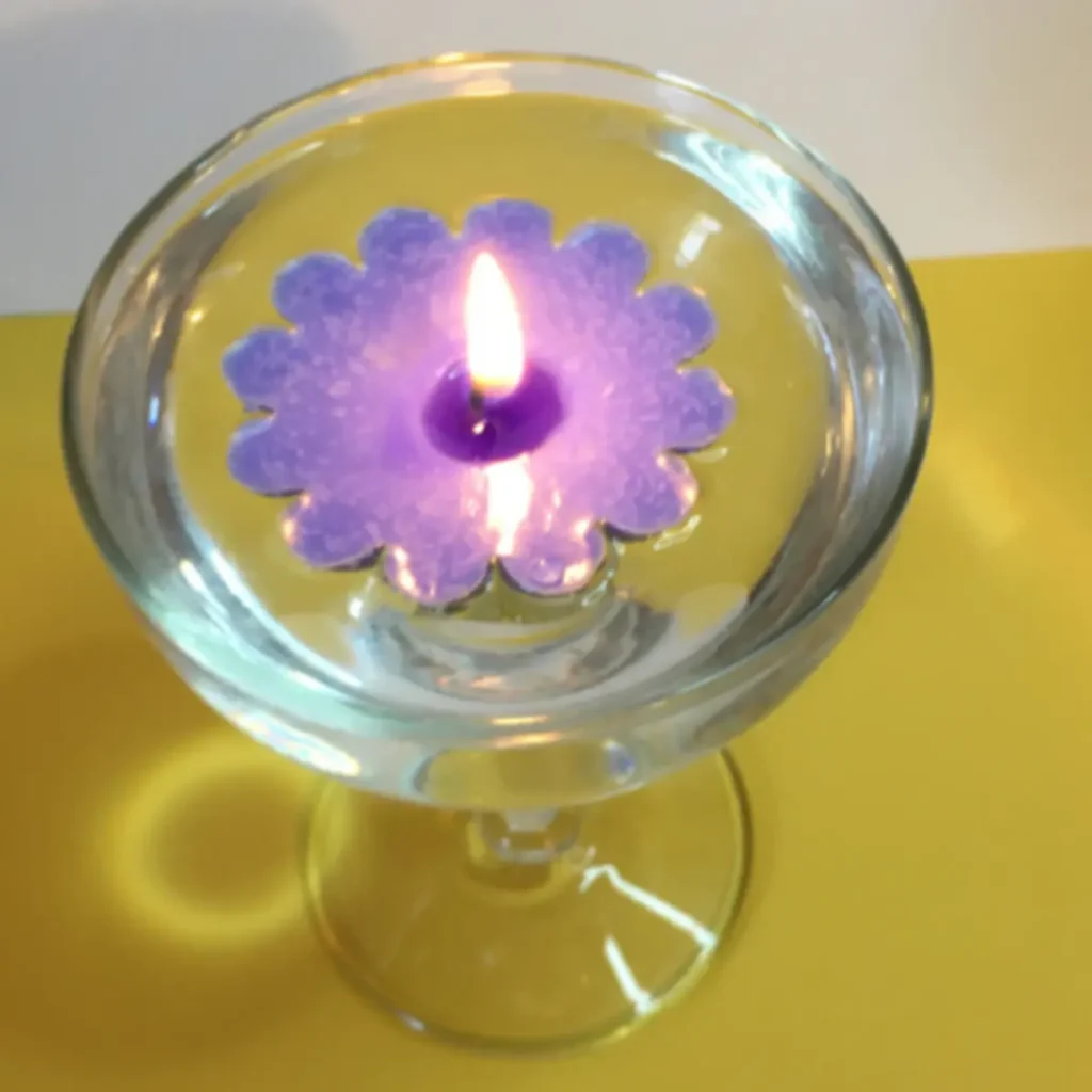 floating candle lit in water