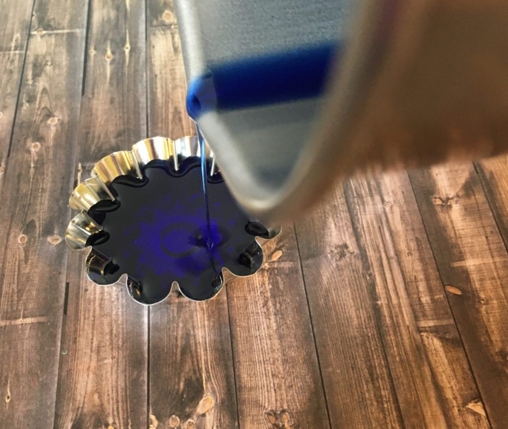 pouring soy wax into mold