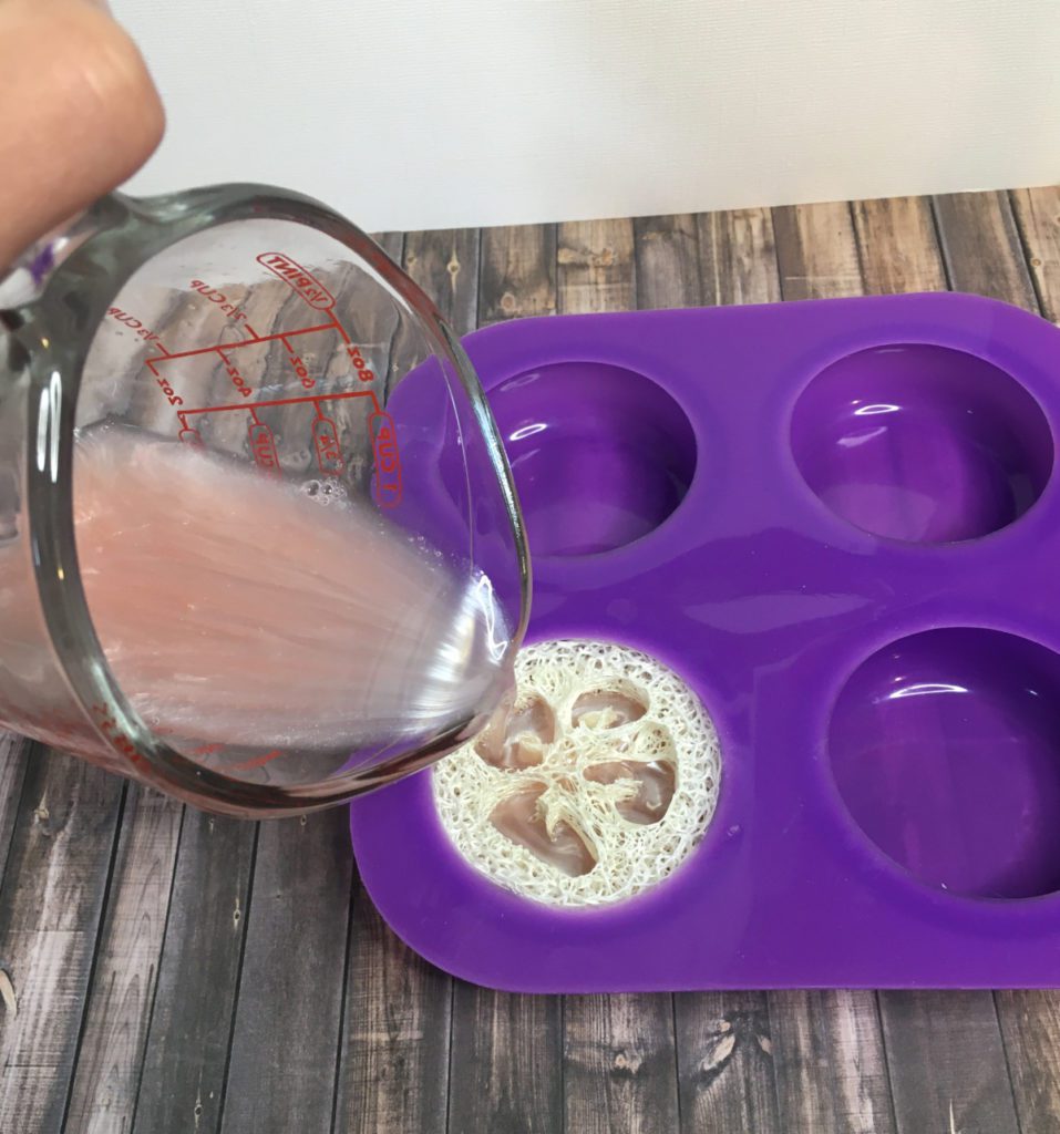 filling silicone mold with melt and pour soap