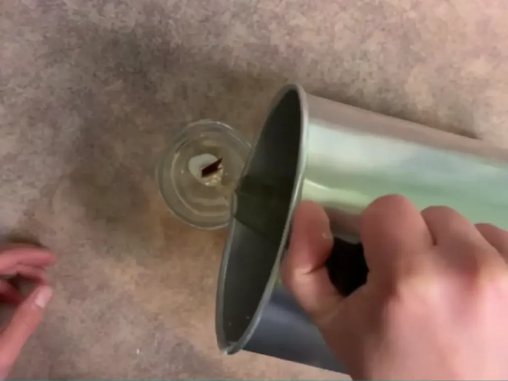 pouring beeswax candle