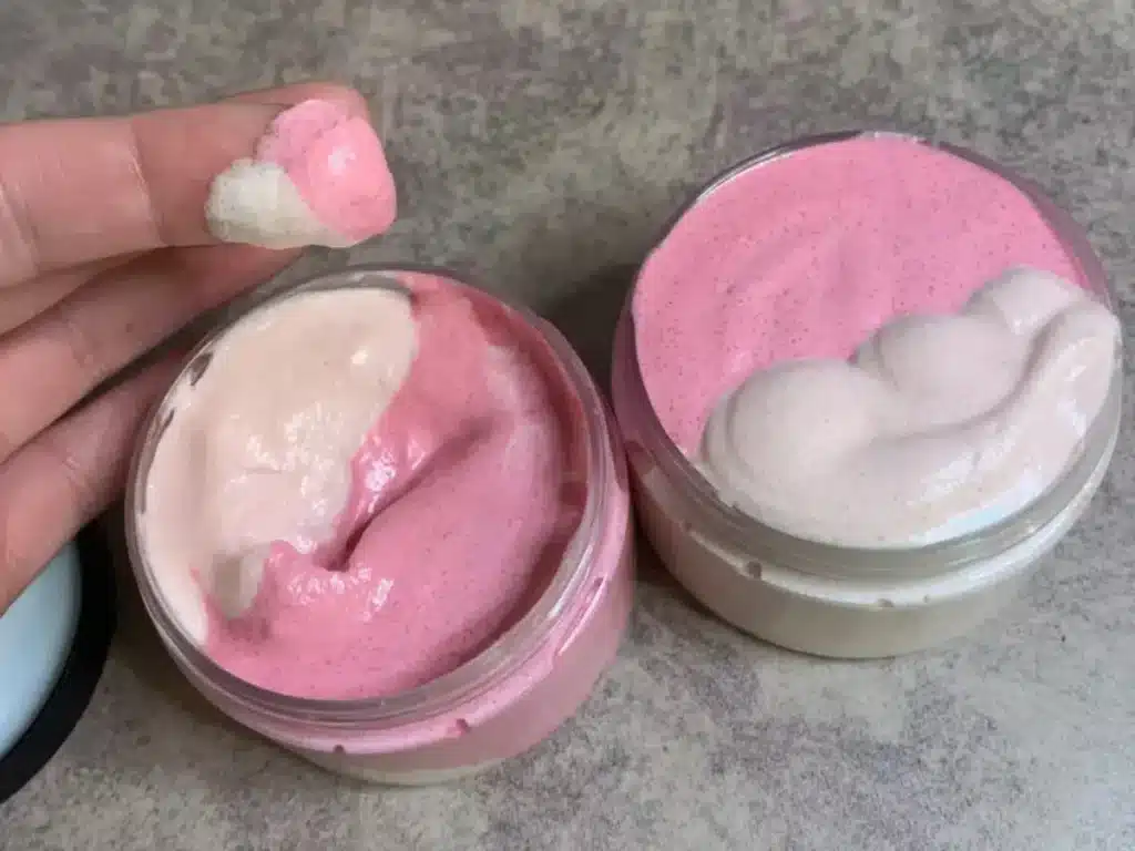 whipped sugar scrub dipping finger into it 