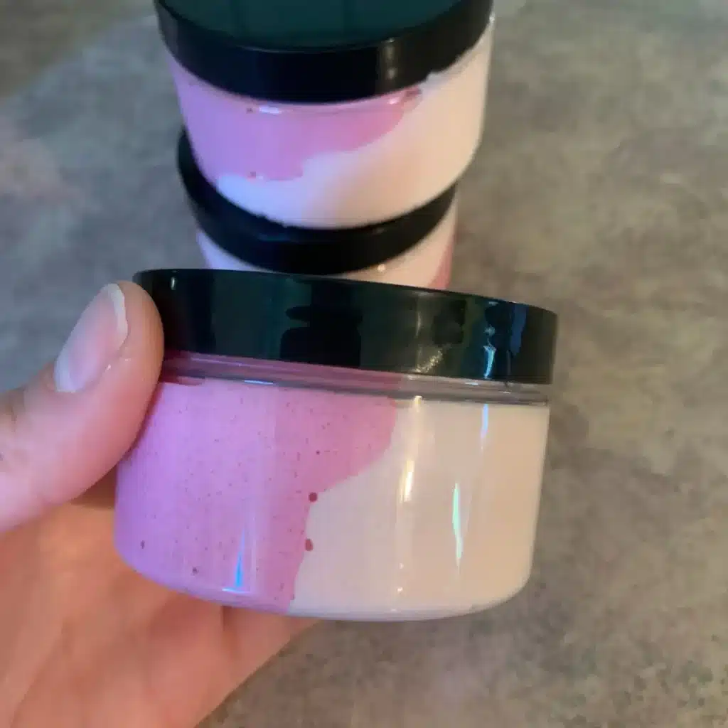 whipped sugar scrub in plastic containers