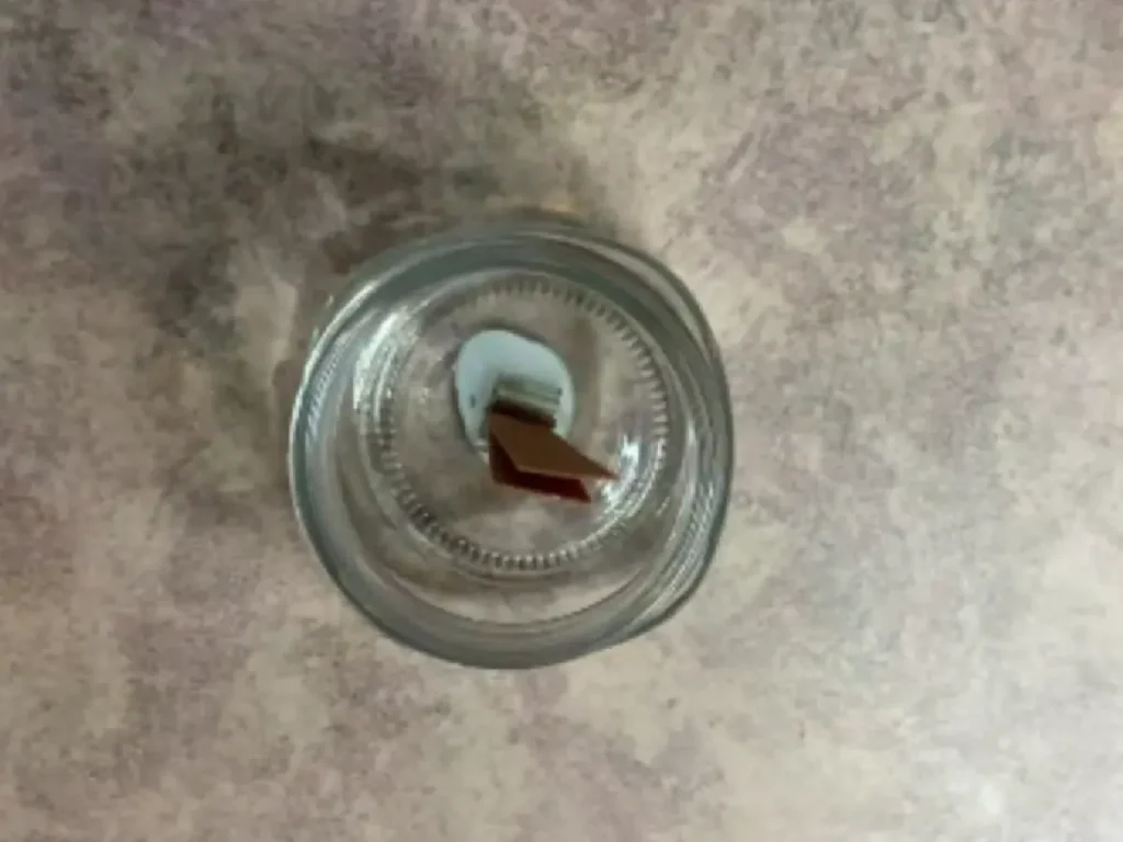 wood wick placed in mason jar