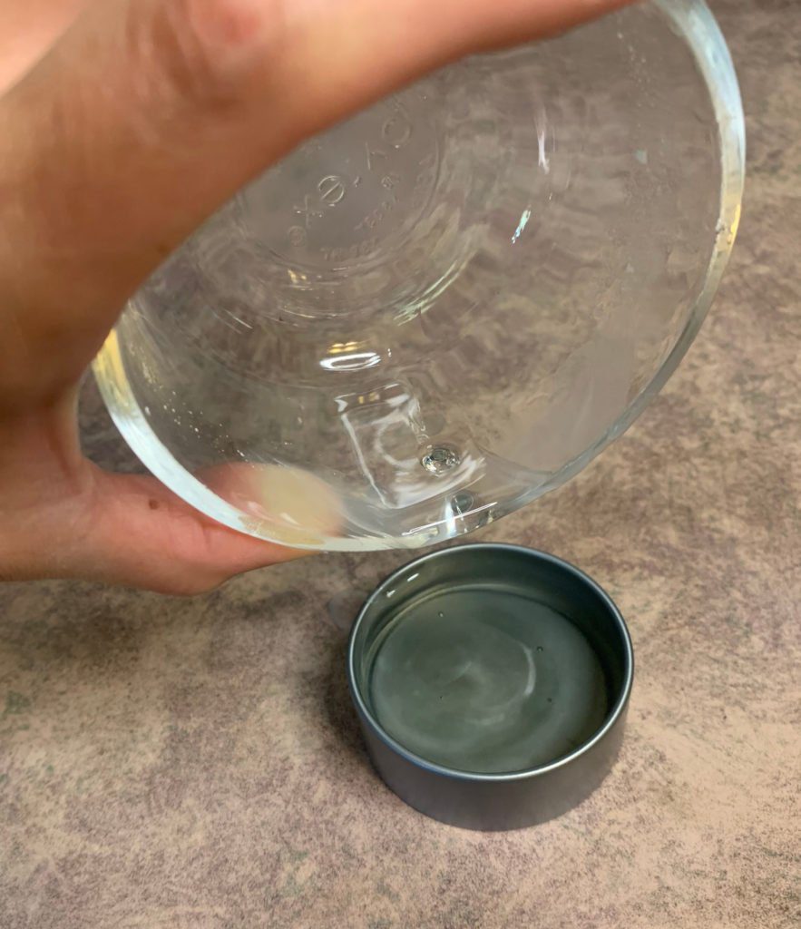 pouring beeswax furniture polish into container