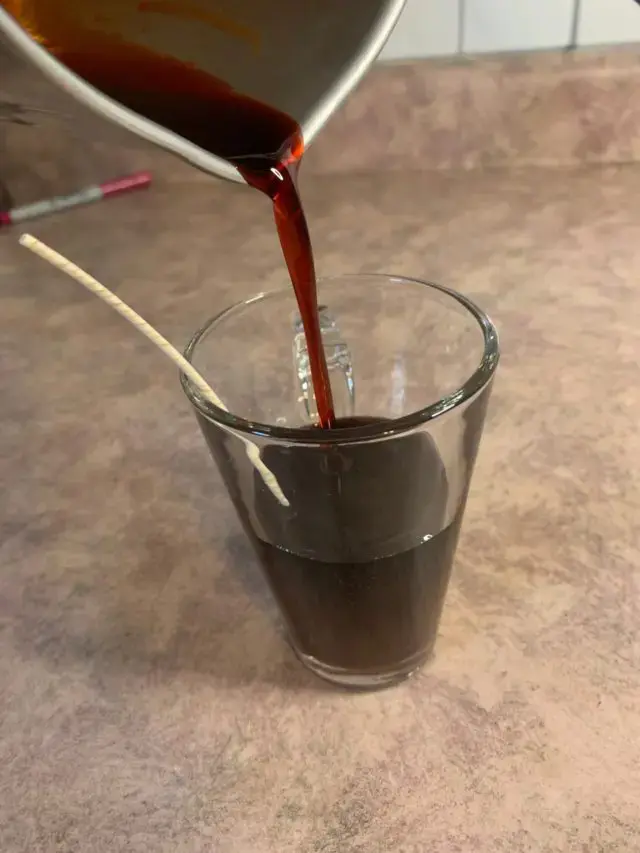 chocolate candle base poured into container 