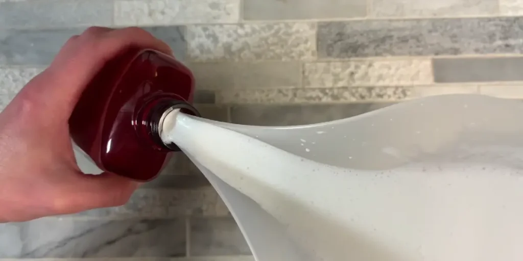 pouring lotion into bottle