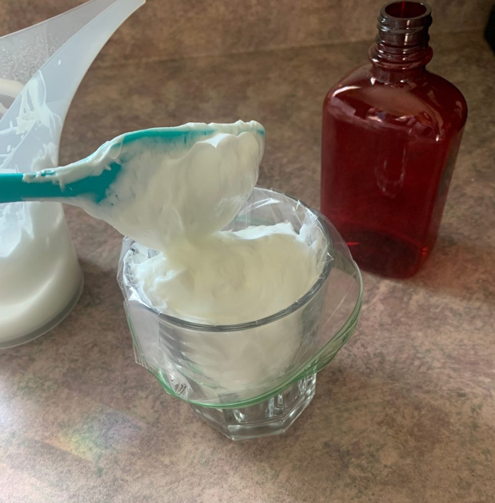 putting lotion into bag