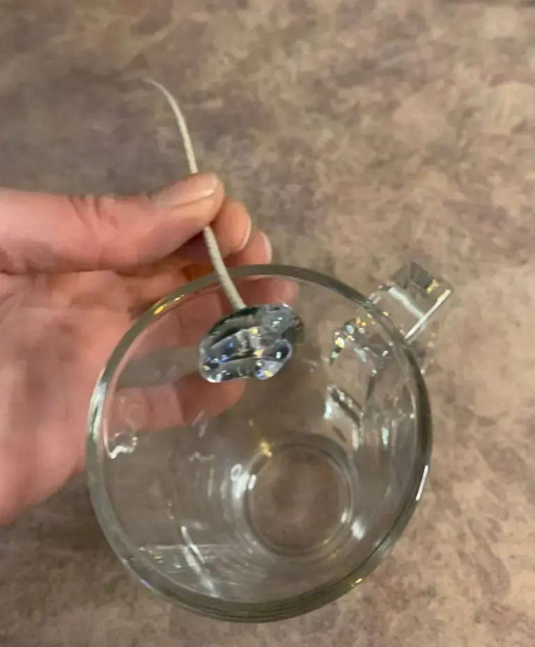 putting-glue-on-the-candle-wick-tab