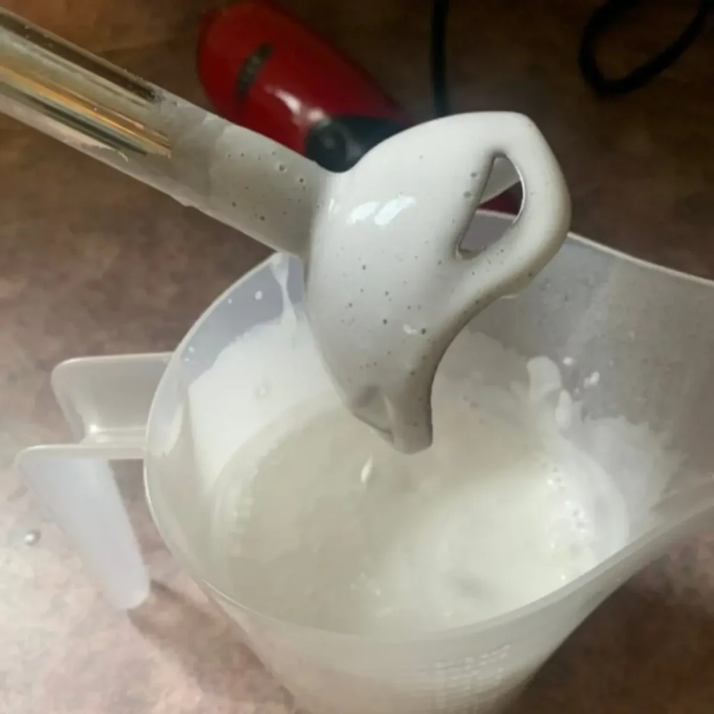 showing consistency of lotion after mixing with immersion blender