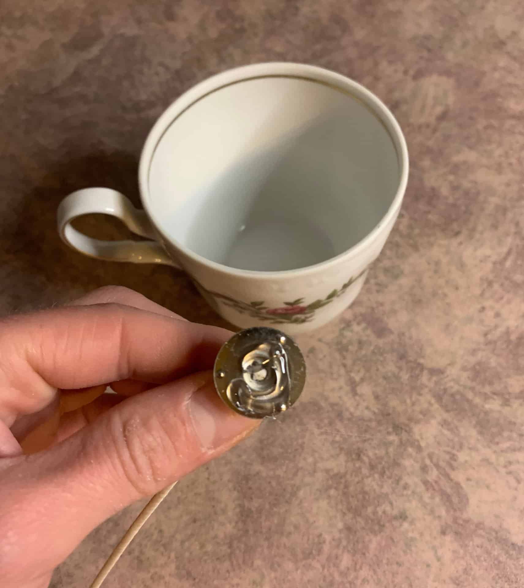 glue on candle wick tab