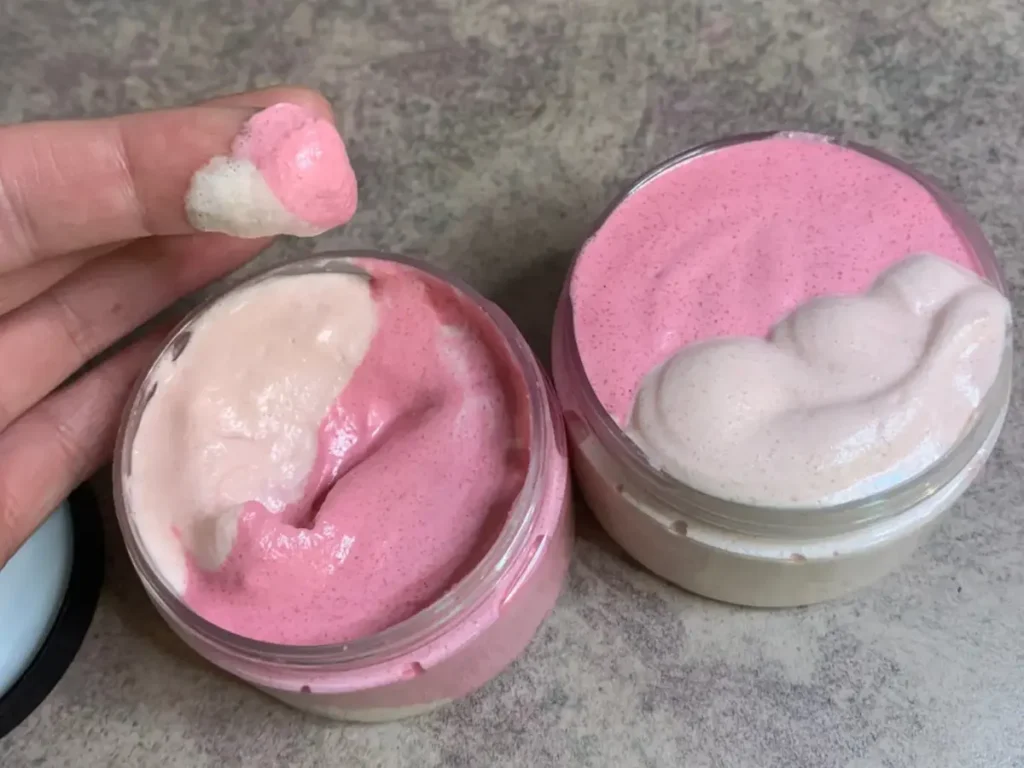 dipping finger to show final consistency whipped sugar scrub