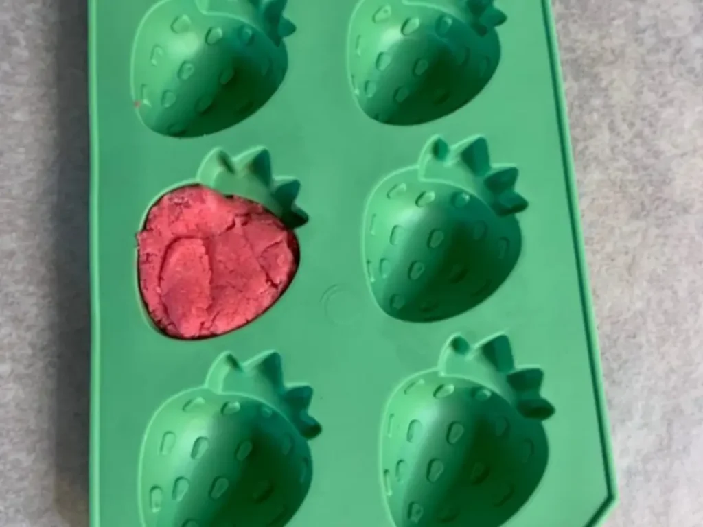 Placing the strawberries in mold red base