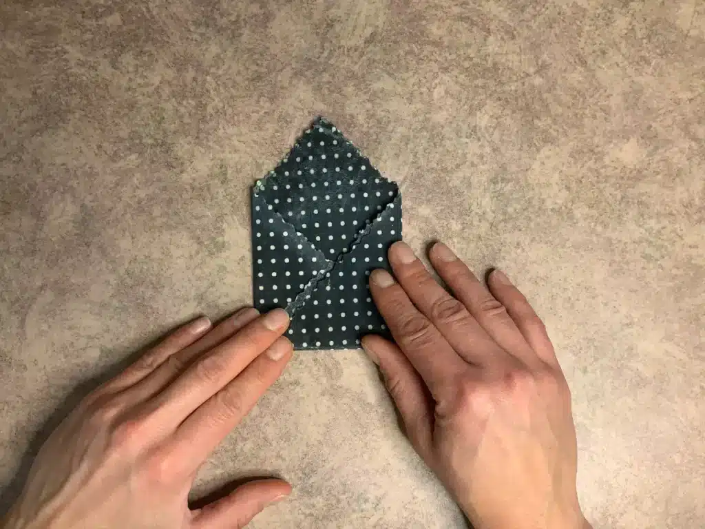 beeswax wrap showing how to fold second side in