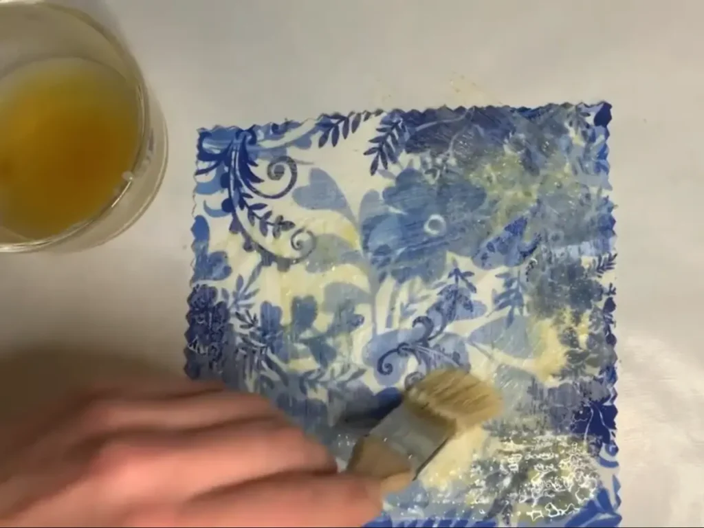painting beeswax mixture on fabric