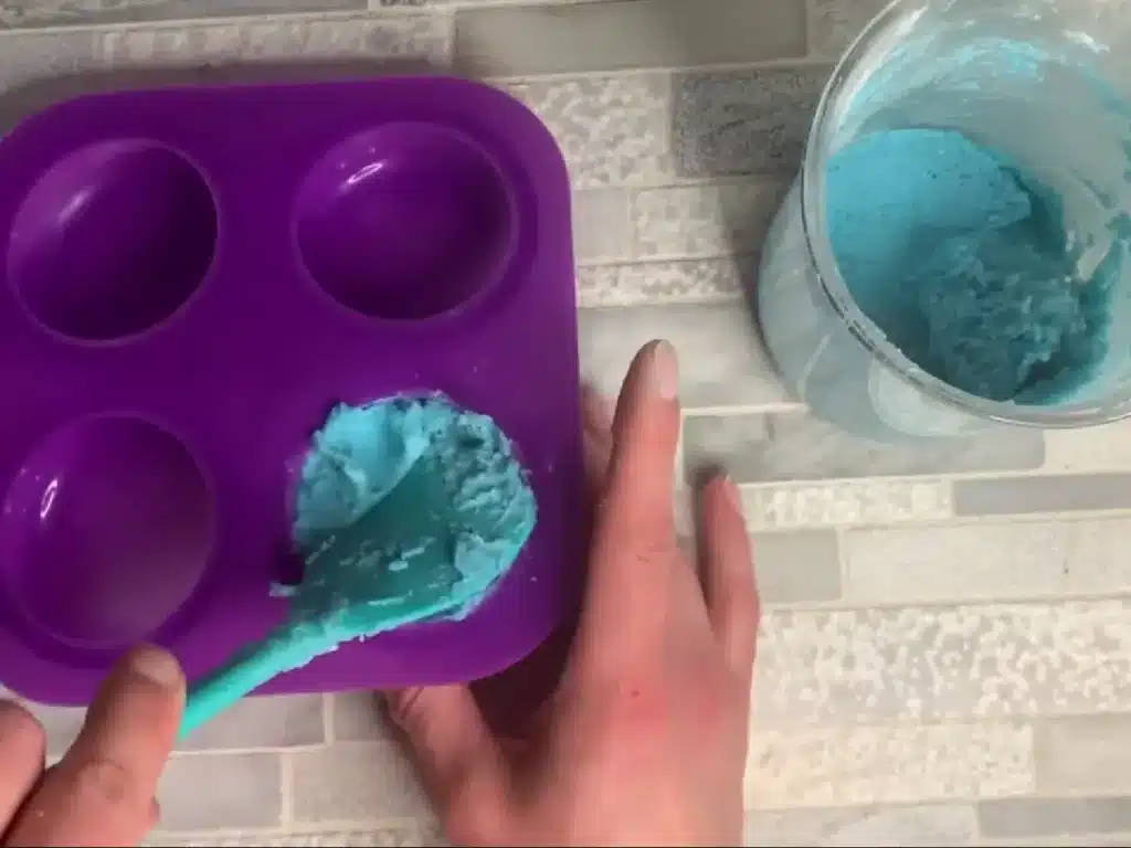 pressing shampoo bar mixture into a mold