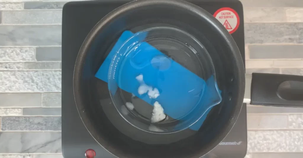 Melting coconut oil on double boiler for salt scrub recipe