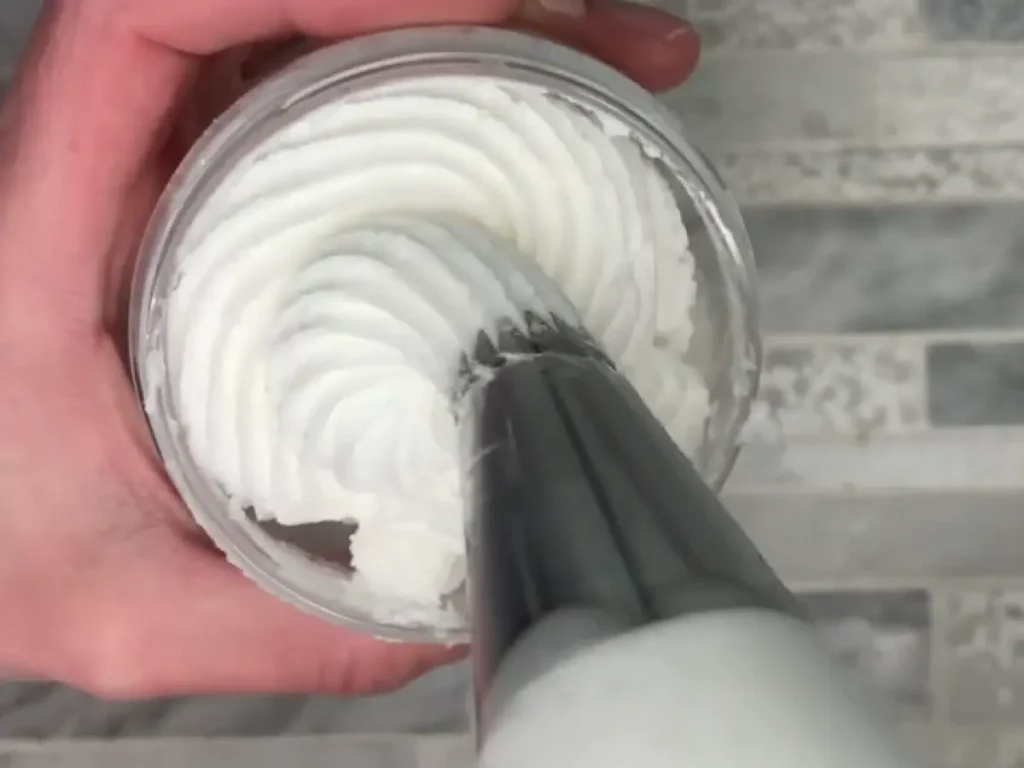 pipping whipped soap into container