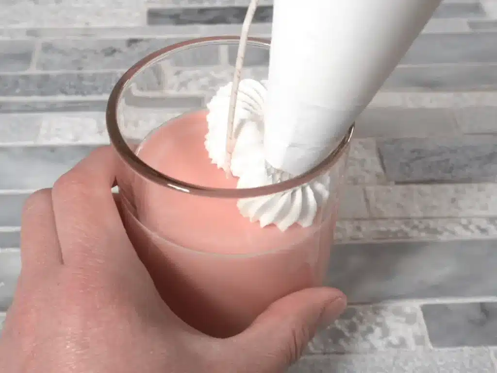 pipping soy wax on top of candle