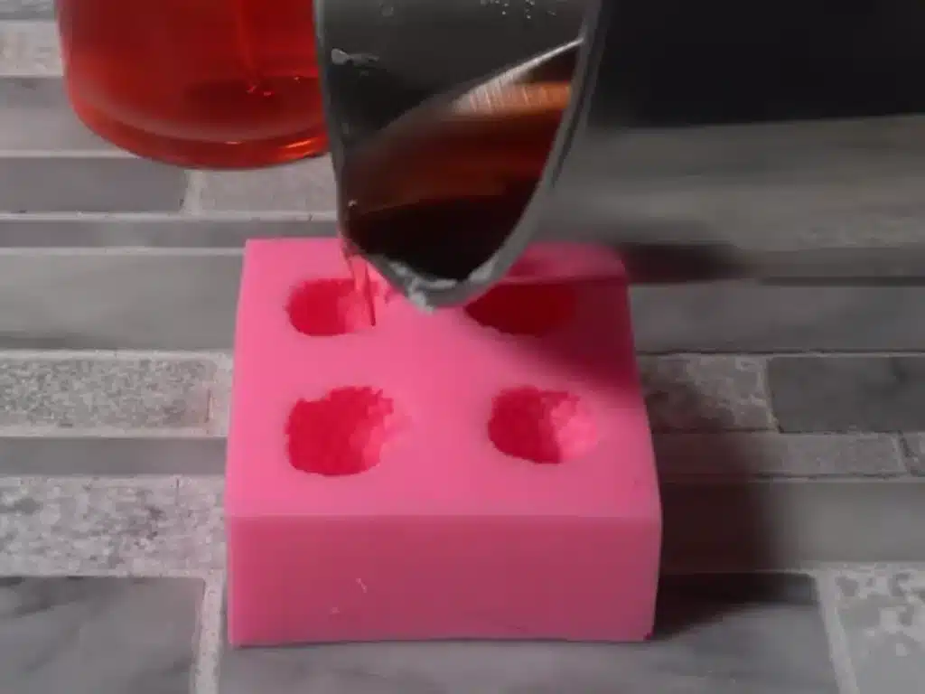 pouring wax embeds for candles that go on the top