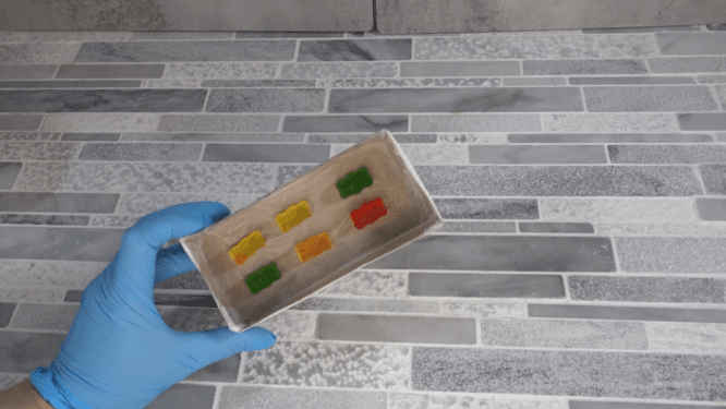 gluing gunny bears down to make silicone mold