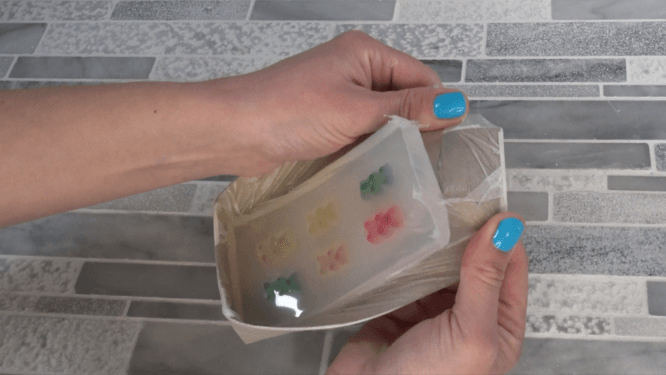 taking gummy bears out of mold