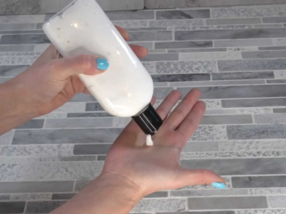 putting lotion on hand