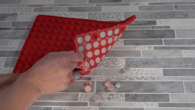 unmolding lotion dots from the silicone mold