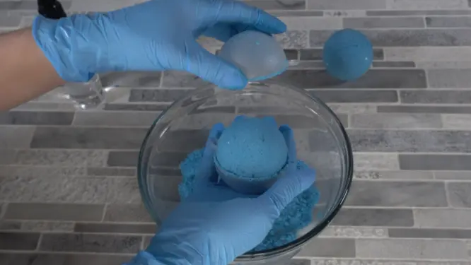 Removing bath bomb from mold carefully