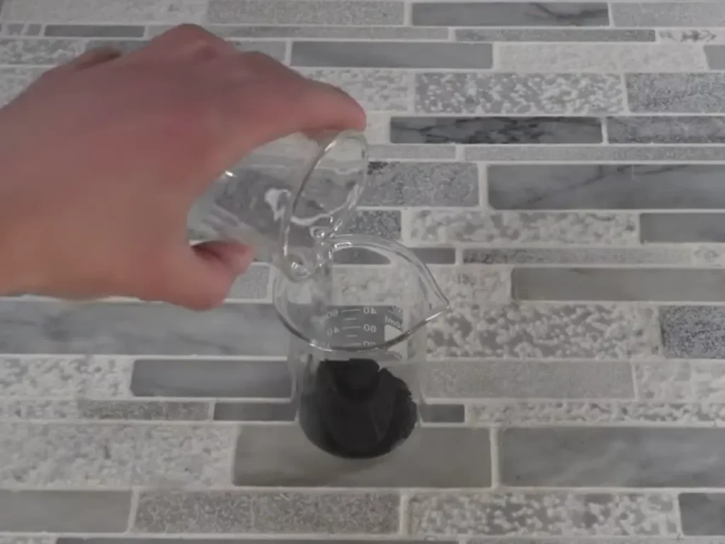 dispersing activated charcoal into water