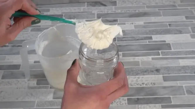 finished whipped body butter putting into container