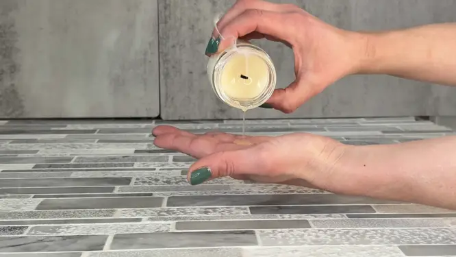 massage candle pouring candle on hand