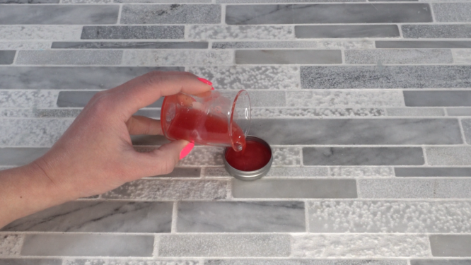 pouring solid perfume into container