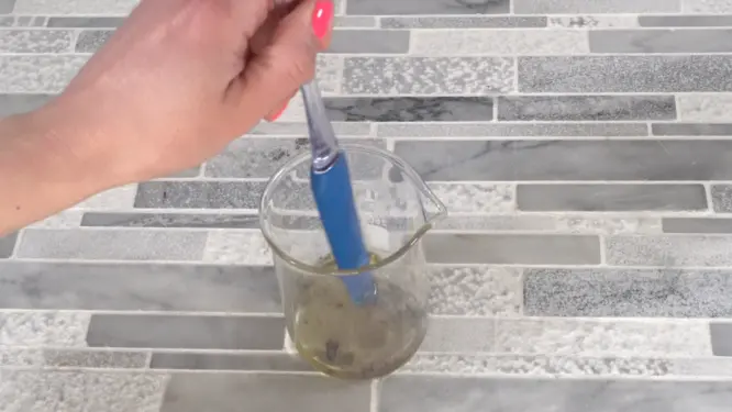 Mixing mica powder into lip balm