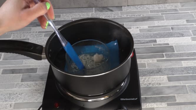 melting oils and butters on double boiler for whipped body scrub