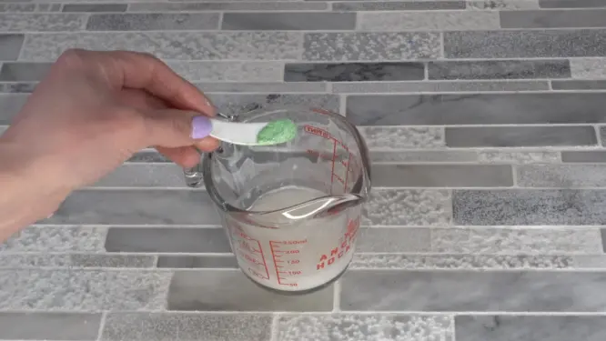 mica powder being mixed into melted melt and pour soap base