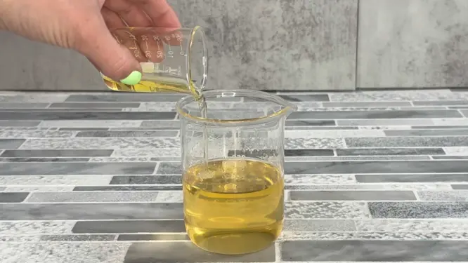 adding jojoba oil and apricot oil to melted butter mixture